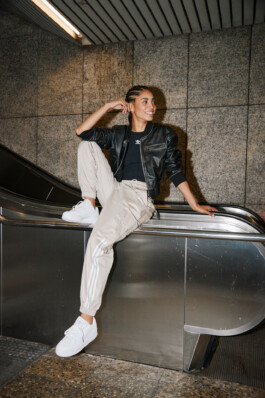 Photo of a young woman in Adidas attire shot in the subway of Munich, fashion editorial for About You by Philipp Messer 