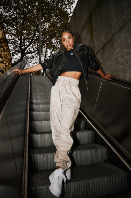 Photo of a young woman in Adidas attire shot in the subway of Munich, fashion editorial for About You by Philipp Messer 