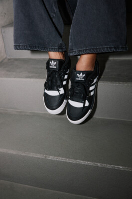 Close up of a young woman in Adidas attire shot in the subway of Munich, fashion editorial for About You by Philipp Messer 