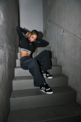 Photo of a young woman in Adidas attire shot in the subway of Munich, fashion editorial for About You by Philipp Messer 