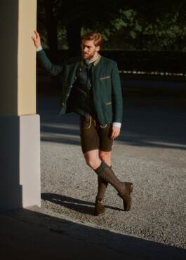 Photo of a young man in traditional German Bavarian Tracht, fashion editorial for Lodenfrey by Philipp Messer 