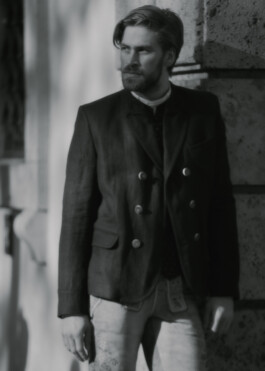 Photo of a young man in traditional German Bavarian Tracht, fashion editorial for Lodenfrey by Philipp Messer 
