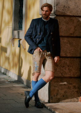 Photo of a young man in traditional German Bavarian Tracht, fashion editorial for Lodenfrey by Philipp Messer 