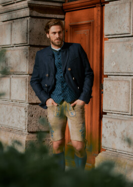 Photo of a young man in traditional German Bavarian Tracht, fashion editorial for Lodenfrey by Philipp Messer 