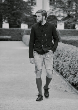 Photo of a young man in traditional German Bavarian Tracht, fashion editorial for Lodenfrey by Philipp Messer 