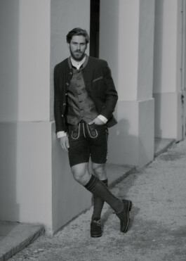 Photo of a young man in traditional German Bavarian Tracht, fashion editorial for Lodenfrey by Philipp Messer 